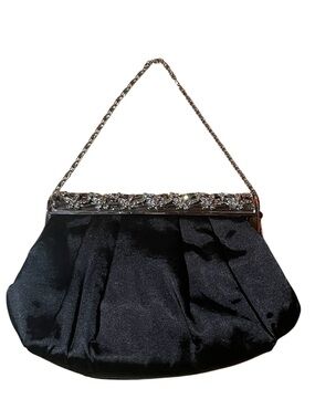 black satin evening clutch with a sparkling rhinestone-adorned frame